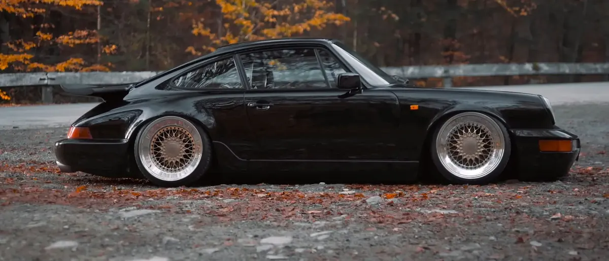 Black classic 911, autumn road