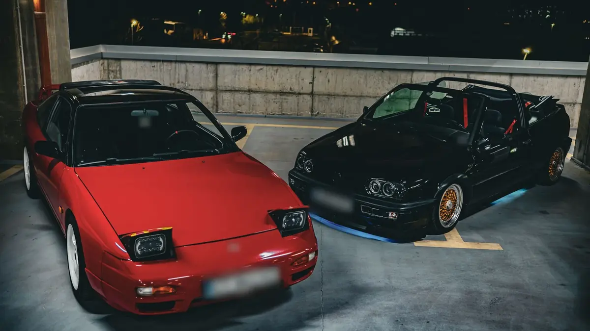 180SX and VW convertible, parking garage